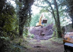 Work begins to remove the waste from the embankment