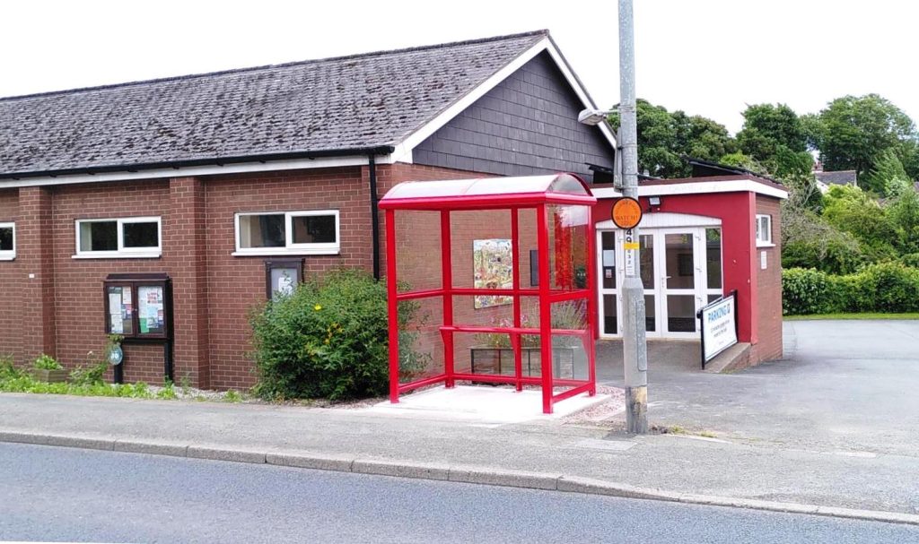 Image of red bus shelter in front of Pant memorial Hall