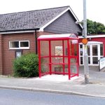 Image of red bus shelter in front of Pant memorial Hall